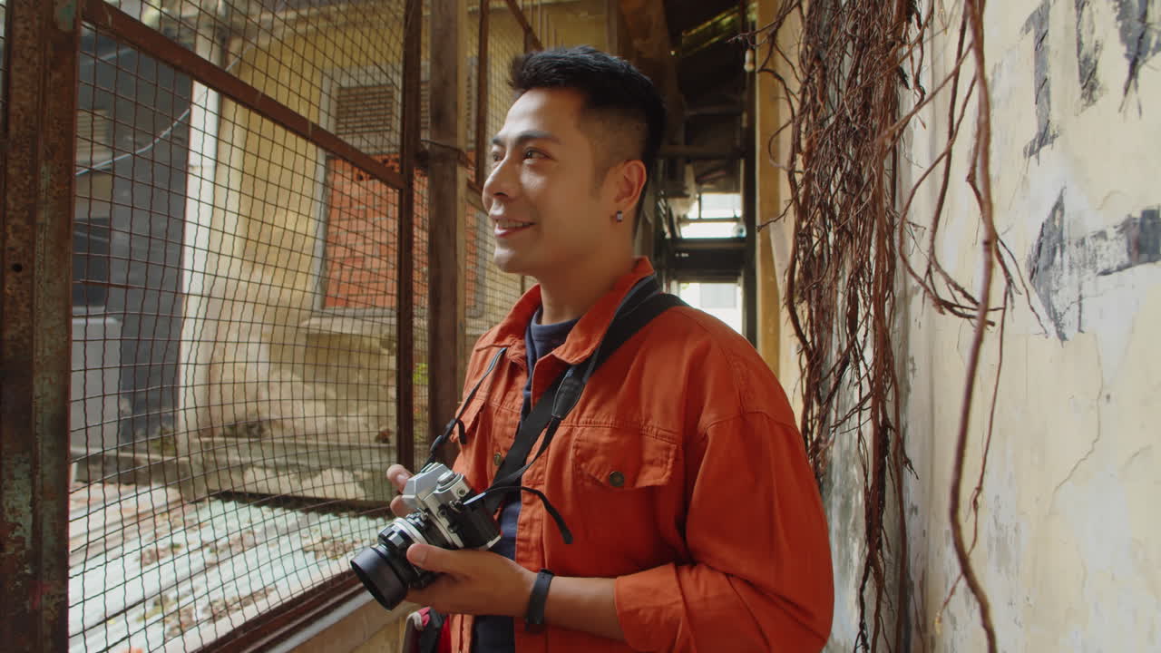 Portrait of Asian Blogger Photographing Abandoned Places