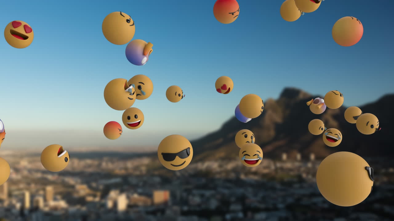 iconos de emoji volando sobre el paisaje