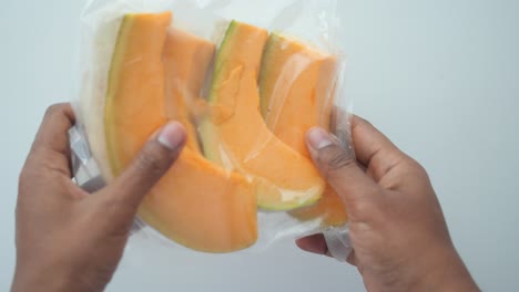 frozen cantaloupe slices in vacuum-sealed packaging