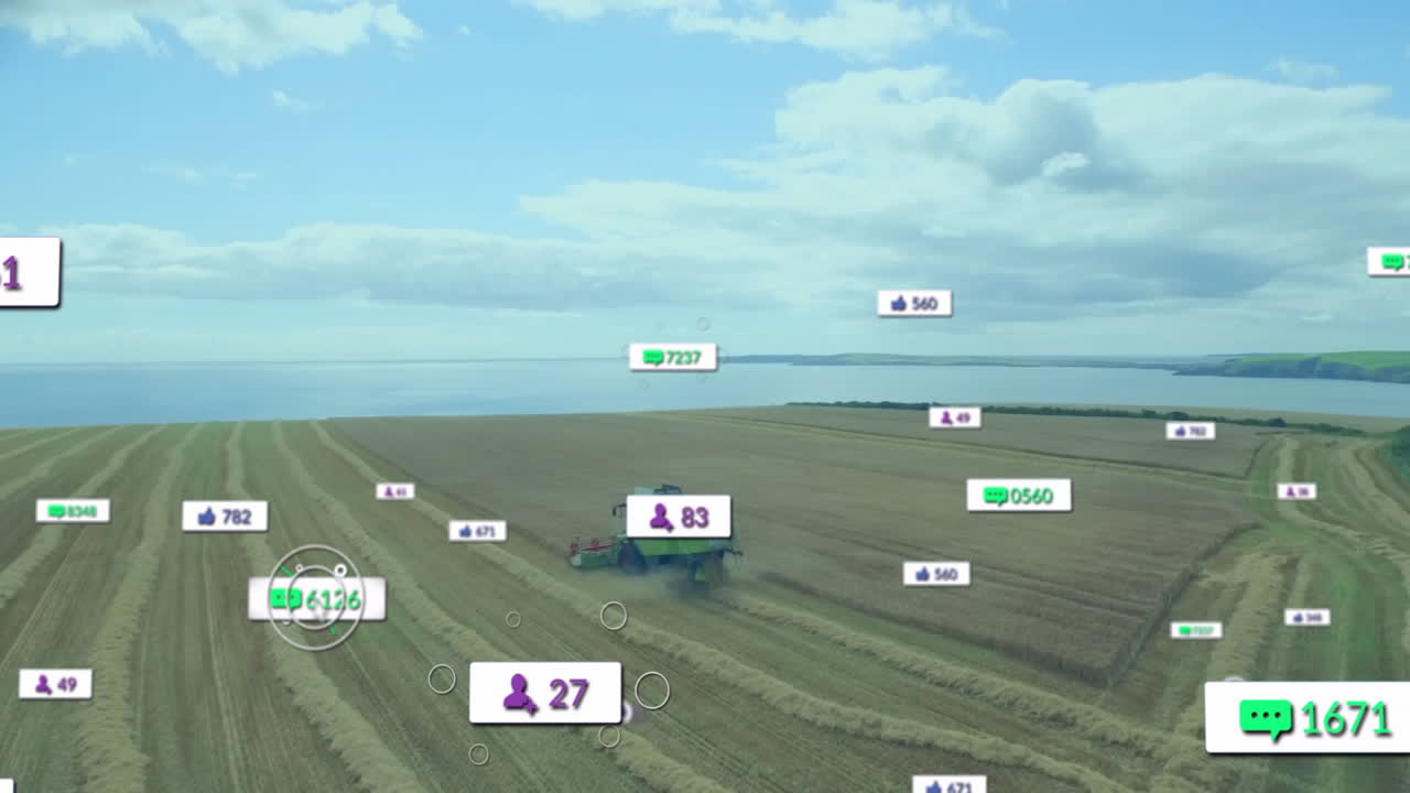 Green combine harvester harvesting field from above while displaying floating social media icons