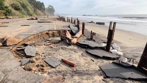 debris at extremely damaged parking lot on the coast of seacliff state beach caused by heavy storm in california, usa