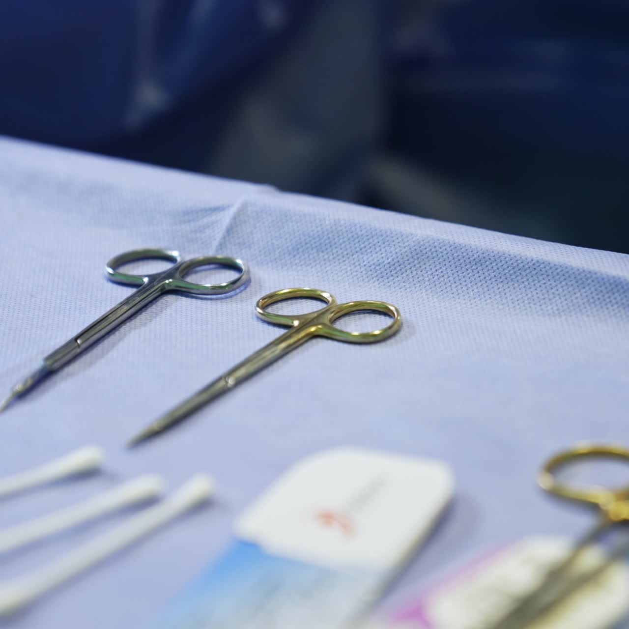 Surgical scissors, forceps and other materials for the operation. Medical tools on the special table. Close up