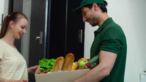 Video of courier delivering fresh fruit and vegetables