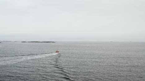 Fishing-Vessel-Sailing-At-Norwegian-Sea-Leaving-Wake-On-Water-Surface-In-Norway