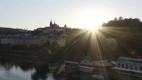 sunset rays over prague city centre and vltava river,czechia,cloudless