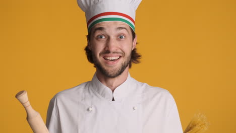 caucasian man in front of camera on yellow background.