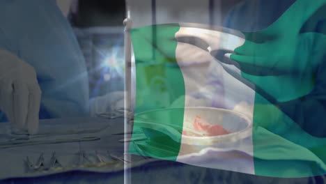 Waving Nigerian flag over surgical tools with medical professional in background