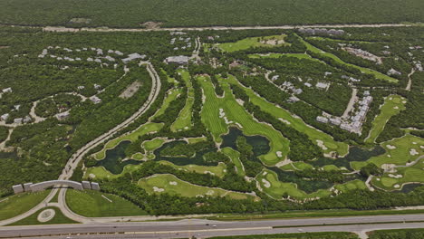akumal méxico aerial v20 high birds eye view sobrevuelo campo de golf con resorts de lujo y casas rodeadas de exuberante jungla maya y vistas al océano - filmado con mavic 3 pro cine - julio 2023