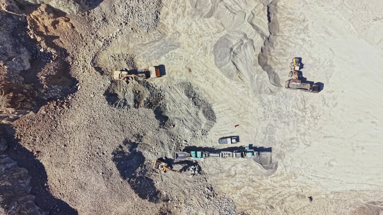 Granite quarry operations showing machinery and terrain from above