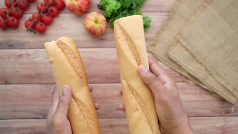 baguettes in hands