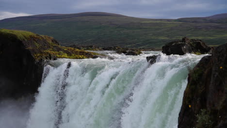 iceland waterfall flowing in daylight