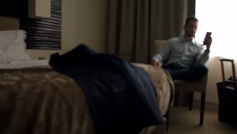 businessman using mobile phone in bedroom 4k