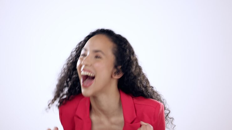 Celebration, fist and happy woman in studio