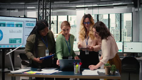 vertical video ambitious female team assembling in the office to discuss new objectives