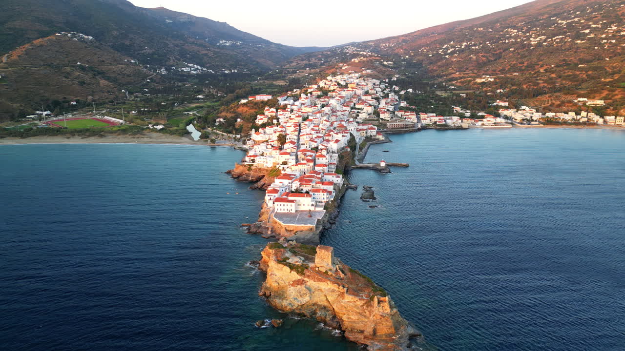 Aerial view video of iconic Andros island chora, Cyclades, Greece at dusk