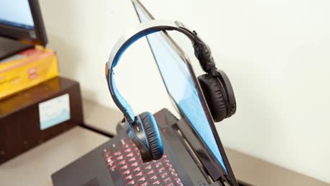 headphones on a laptop computer in an office