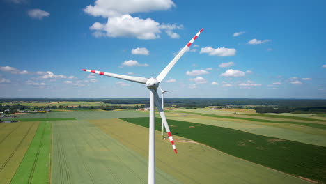 Aerial-Close-Up-of-Wind-Turbine-on-Countryside-Green-Agricultural-Field