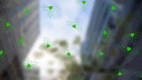 animation of christmas holly pattern over out of focus cityscape in background