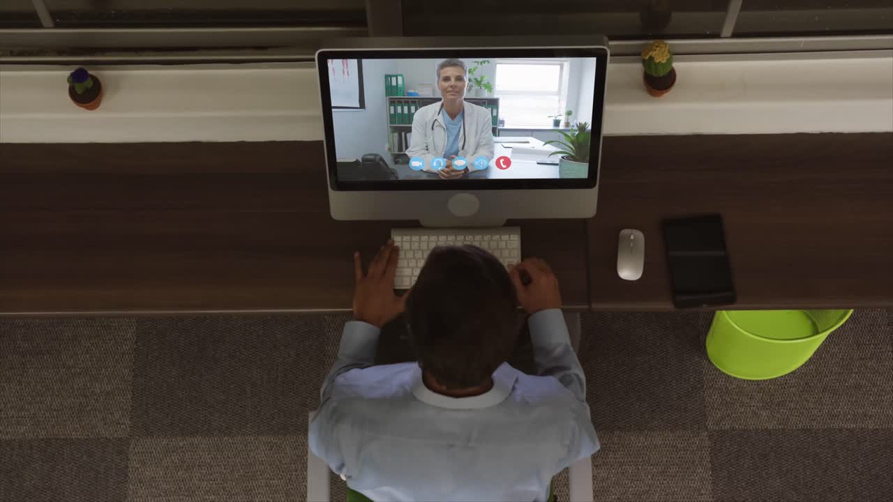 Overhead view of man having a video conference