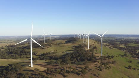 aerial view of wind power turbines spinning