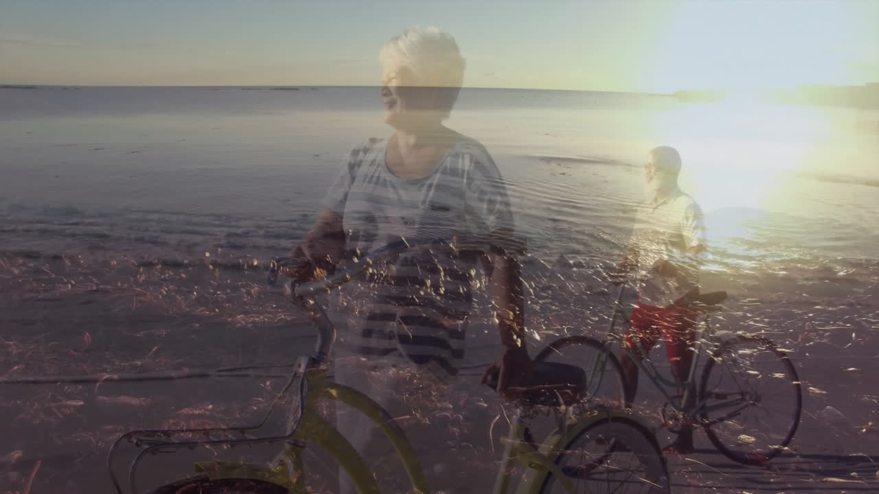 Retiree couple holding bicycles on sunset beach, displaying animated heart icon and health chart