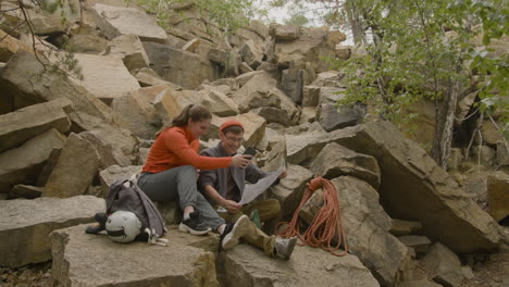 Climbers-sitting-on-a-rock