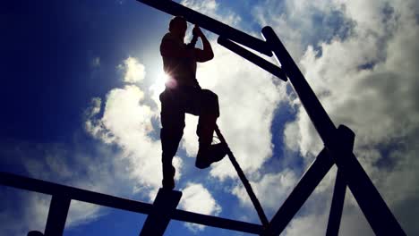 military soldier climbing rope during obstacle course 4k