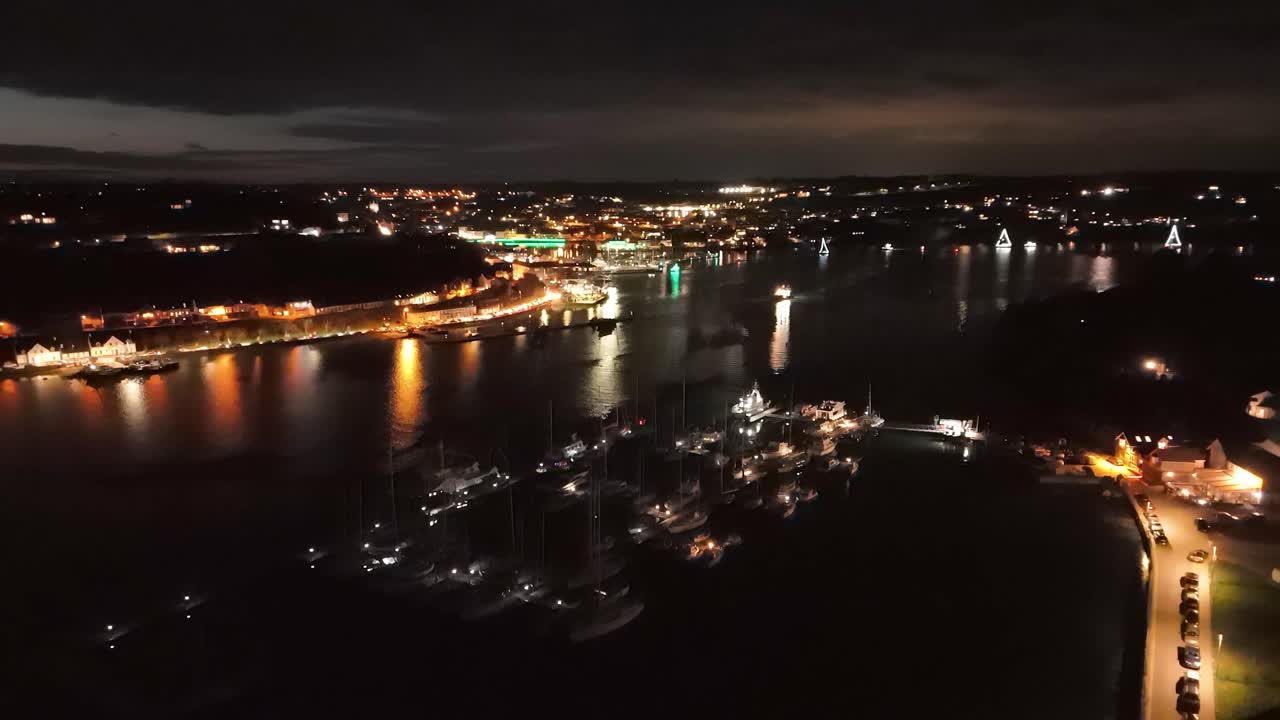 Kinsale night lights and celebration, marina and town from above at St. Patrick's eve, Ireland