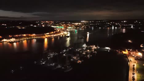 kinsale night lights and celebration, marina and town from above at st. patrick's eve, ireland