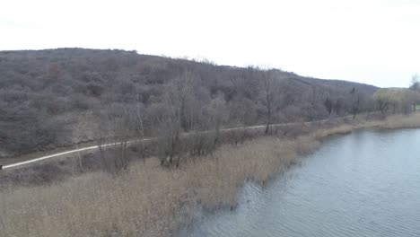 small lake in the valley on a rainy day, birds eye view, lake garancs in hungary