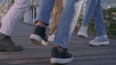 a group of people walking on a bridge