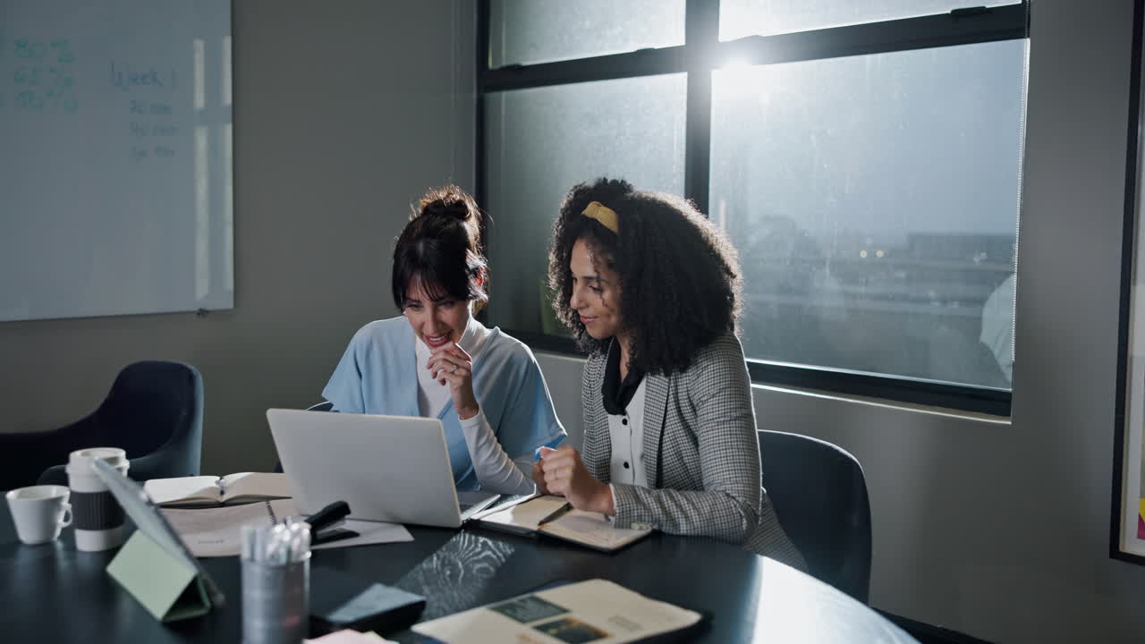 Two Businesswomen Celebrating Success in the Office