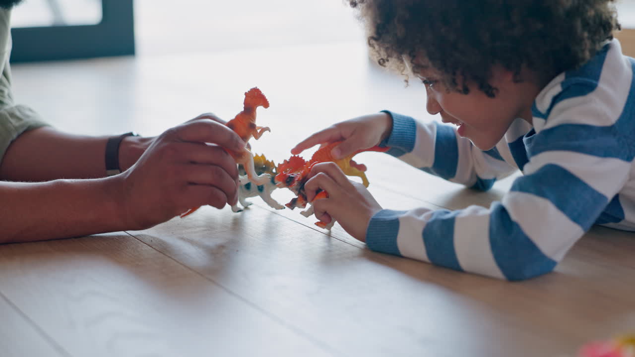 Father and Son Playing with Dinosaurs