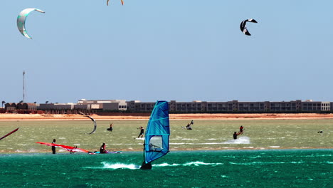 people practicing water sports, windsurfing, beach of hurghada egypt daily sun light, summer vibes, 60 fps