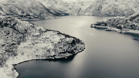 coastal winter landscape of svolvaer town in norway - aerial drone shot