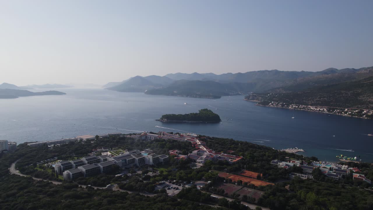 Aerial: Otočić Daksa, Croatia: azure waters, island beauty, luxury hotels