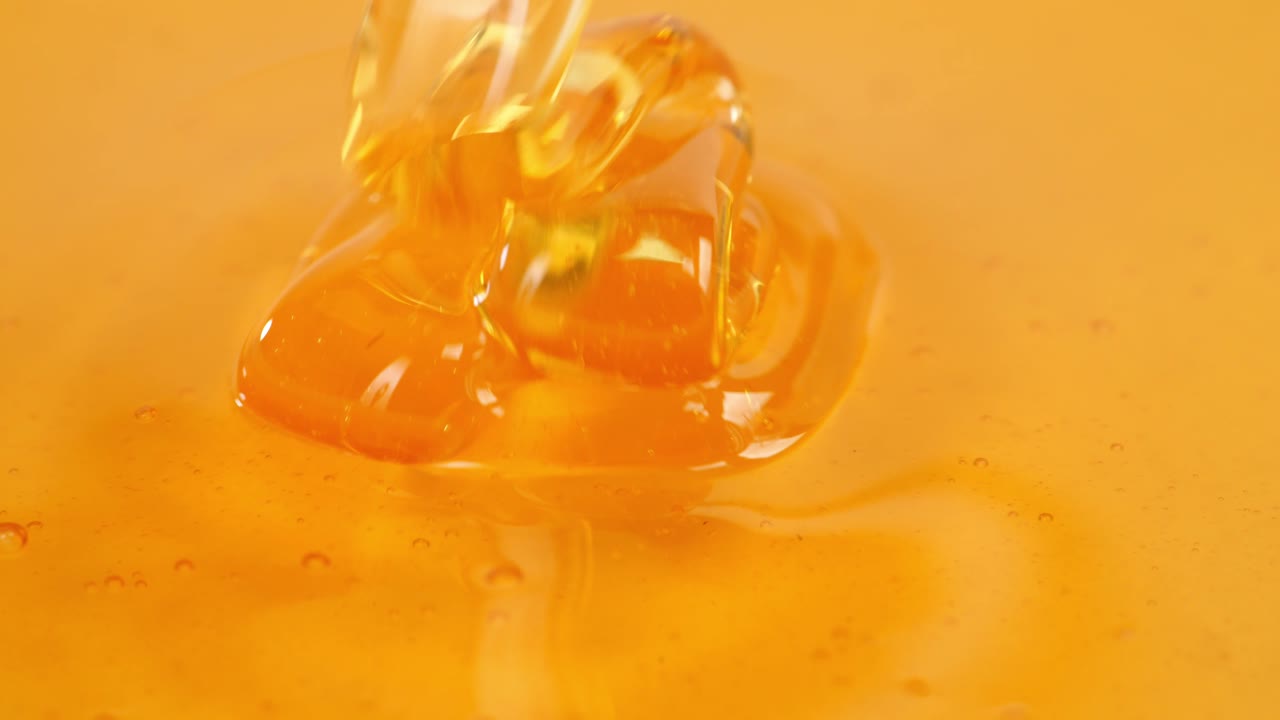 Loop Of Thick Honey Dripping, Close Up Of Pouring Honey On Honey. Healthy Organic Thick Honey, Sweet Honey Dessert 4K. Slow Motion