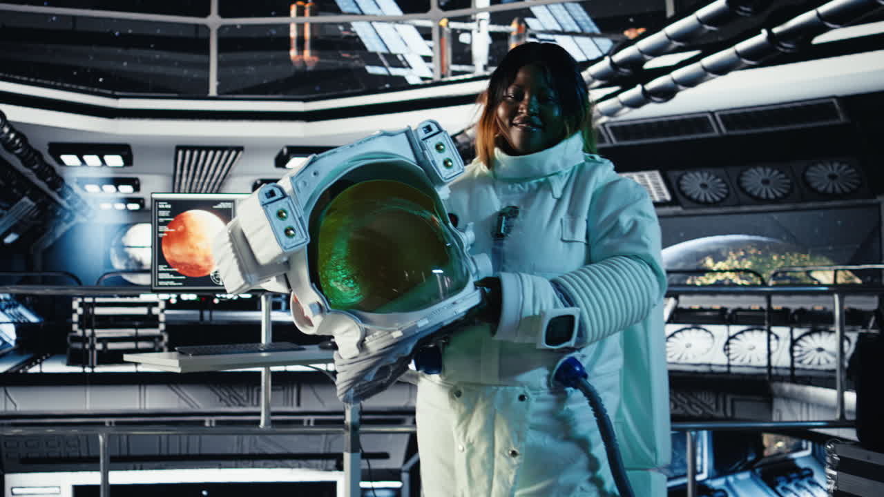 Portrait of happy astronaut holding helmet in space station completing mission