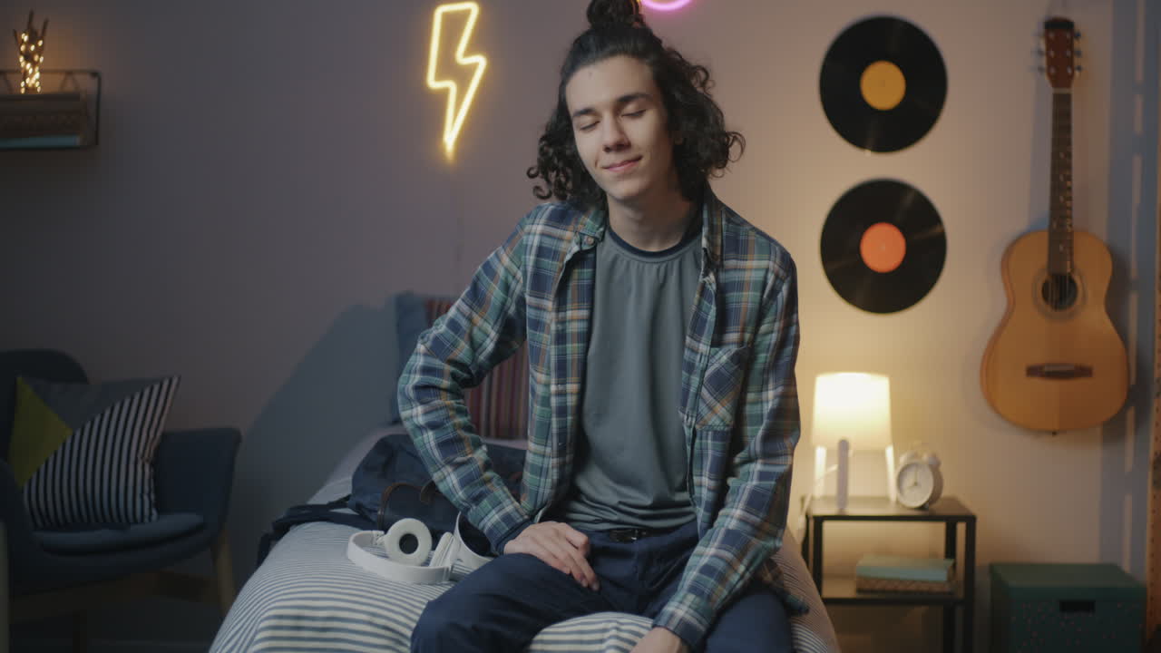 Teenage boy in his bedroom