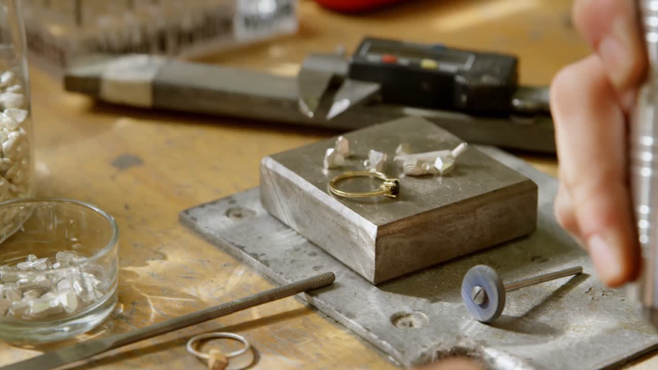 Jewelry designer working in workshop 4k