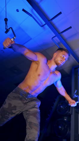 athlete with strong body doing work out pushing up excercise in gym. view from the bottom. vertical video