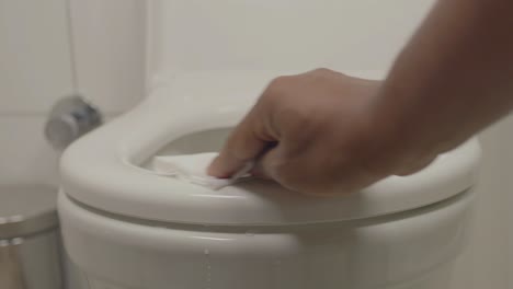 cleaning a toilet