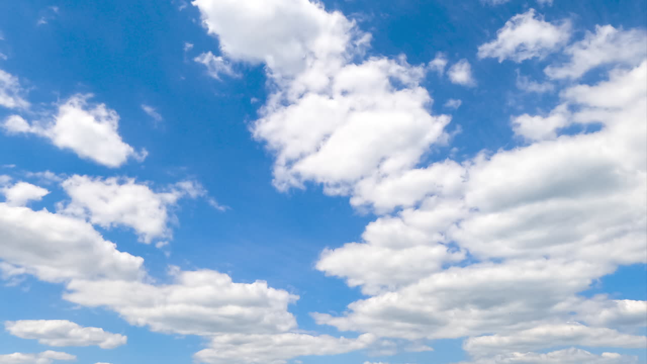 Beautiful transforming cloudscape in the bright blue sky. Fantastic timelapse on summer daytime.