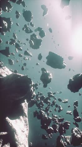 a view of an asteroid field in space