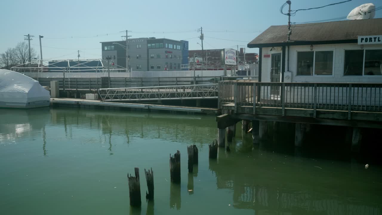 Steady view of port office surrounded by water in Portland, Maine, USA, atmosphere and scenic waterfront location.