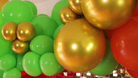 mexican decor with green and gold balloons with golden backdrop