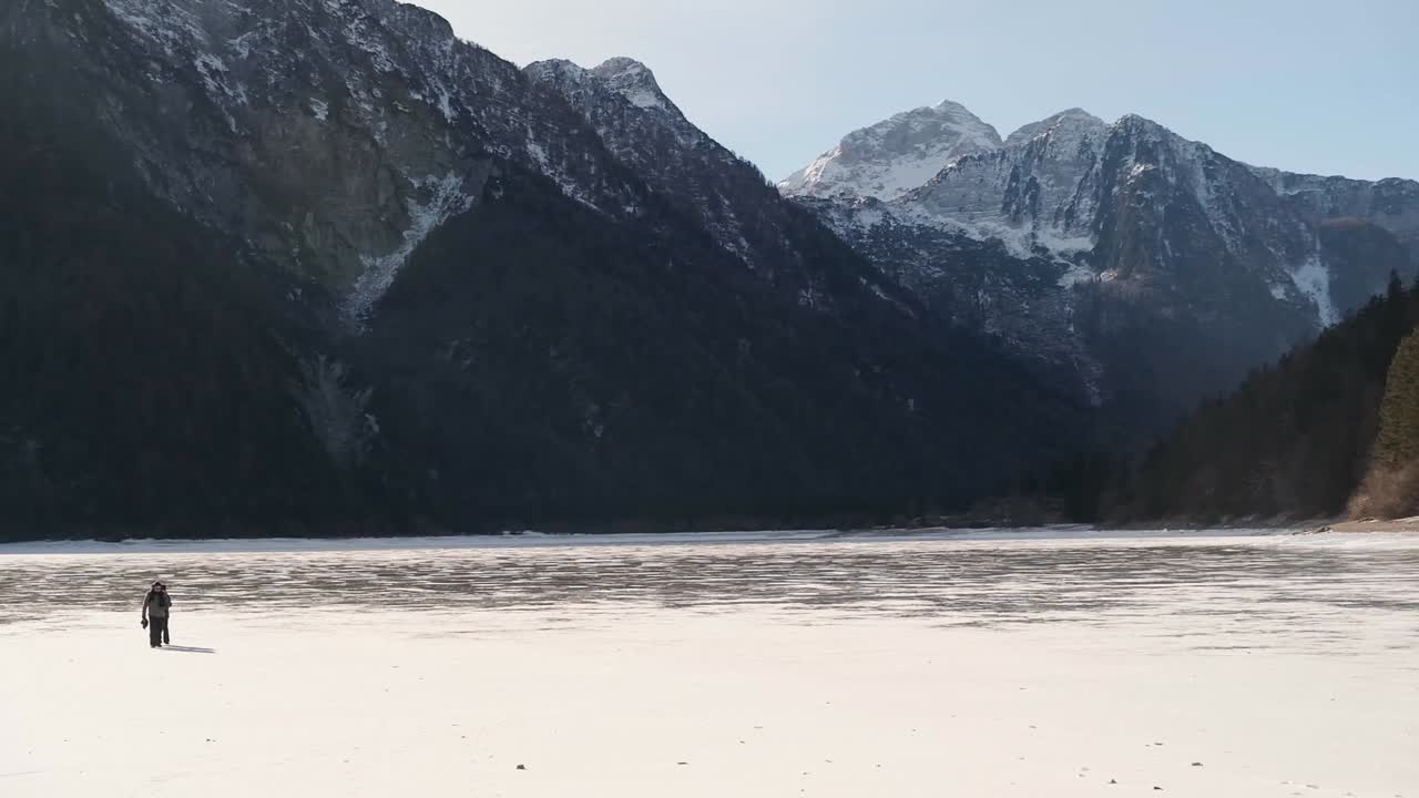 Lago del Predil, Tarvisio - Italy a frozen alpine lake in a snow-covered winter fairytale mountain landscape