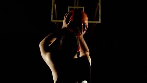 Male-basketball-player-throwing-basketball-in-the-basketball-hoop-4k