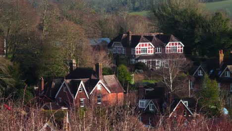 A-View-of-a-Beautiful-Village-Nestled-in-Rolling-Hills,-Forests-and-National-Park