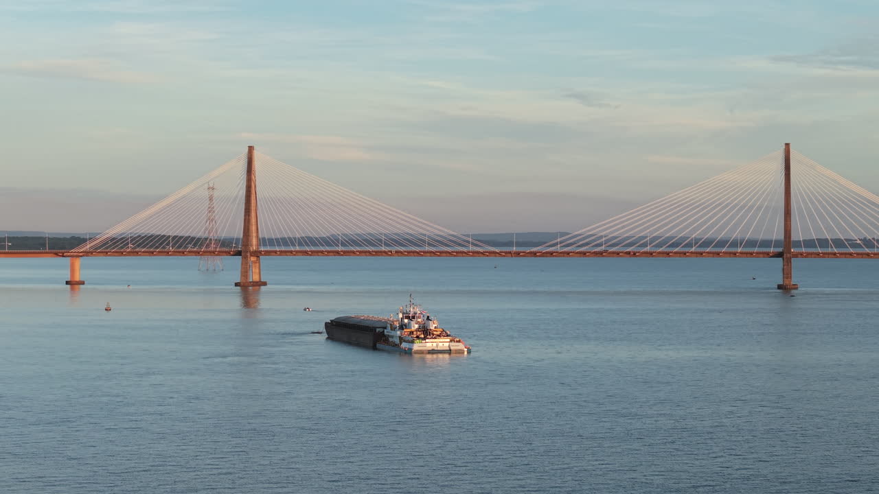 Bulk carrier crosses bridge over Parana River, international cargo and regional development